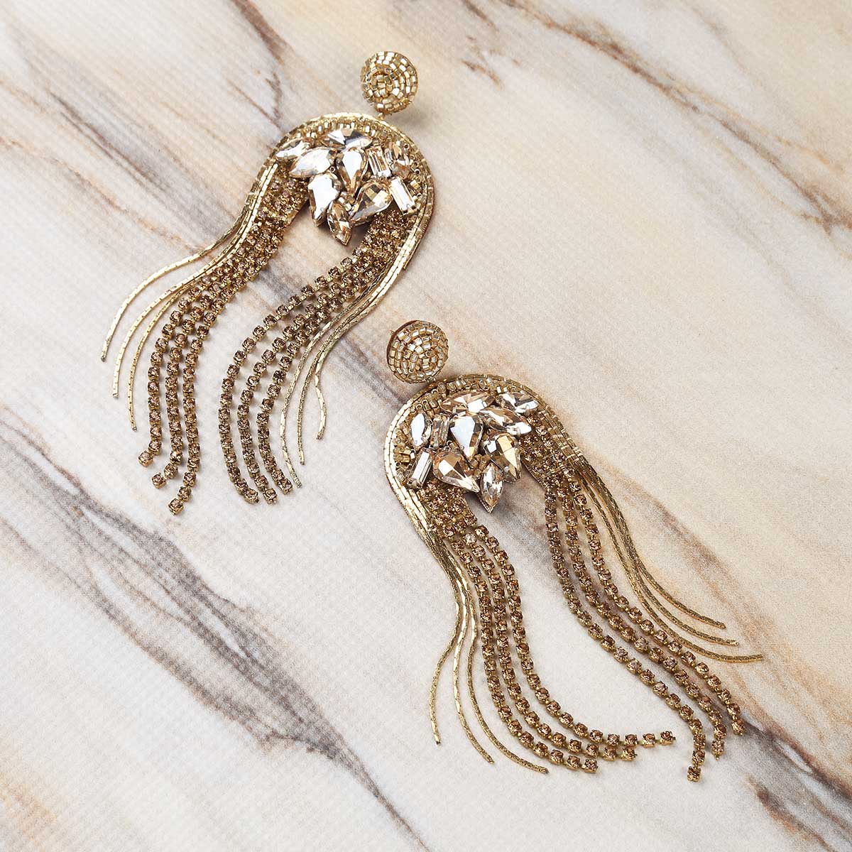 Deepa Gurnani Handmade Kylee Earrings in Gold on Marble Background