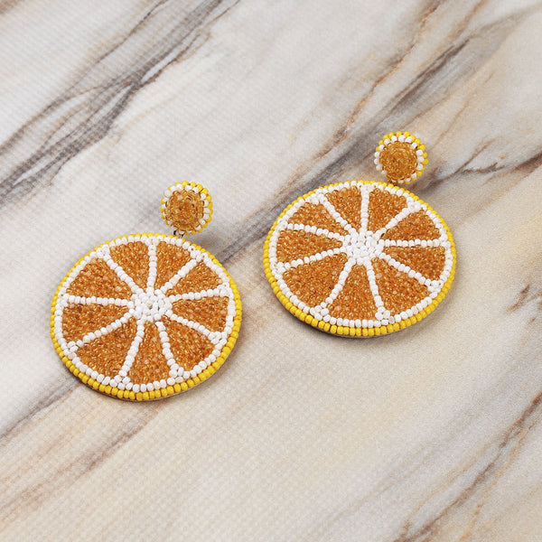 Deepa Gurnani Handmade Lemon Earrings on Marble Background