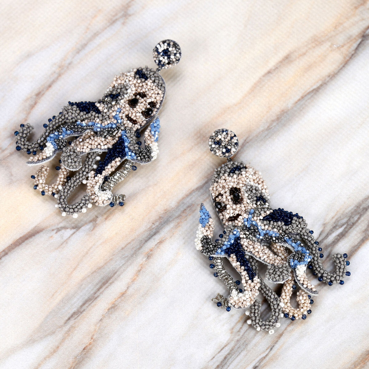Deepa Gurnani Handmade Octopus Earrings on Slate Background