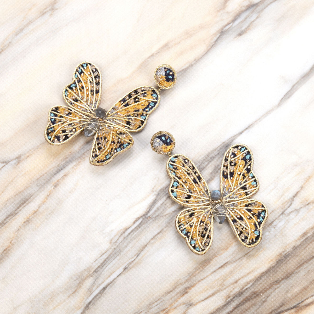 Deepa Gurnani Handmade Butterfly Earrings on Slate Background