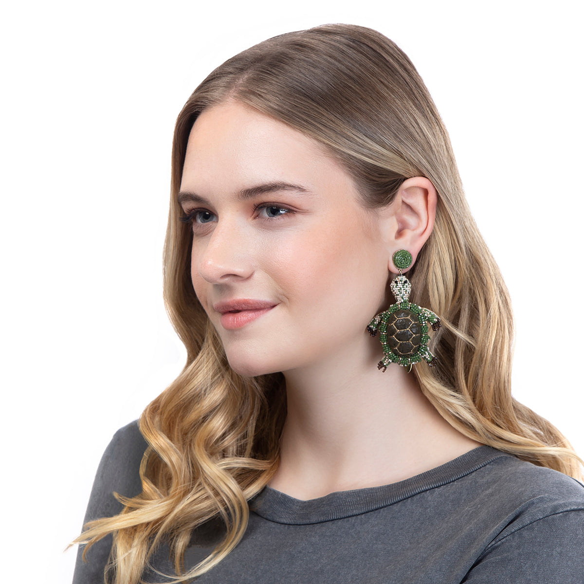 Model wearing our Hand embroidered Turtle earrings