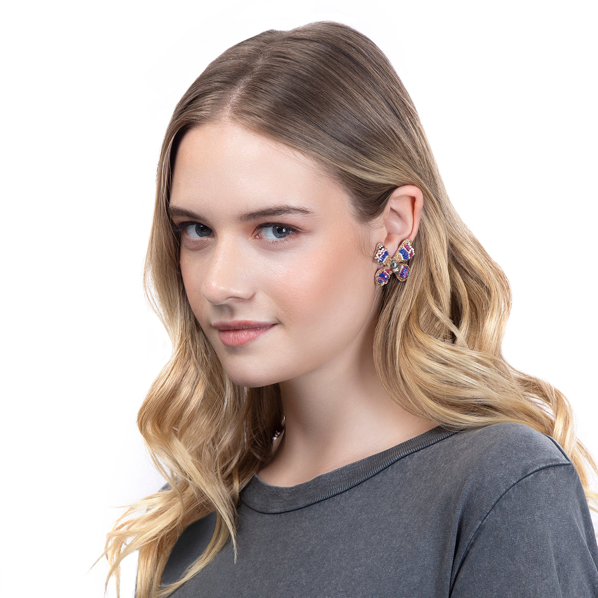 Model wearing our Lightweight small butterfly earrings